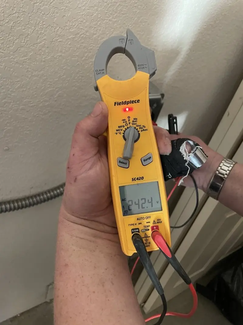 Voltage testing with clamp meter during Outlet Installation in Mission Bend